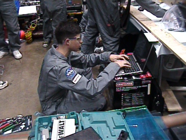 Aaron programming in the pit