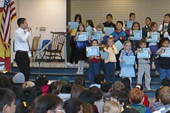 Mr. Corral and the awardees on stage.